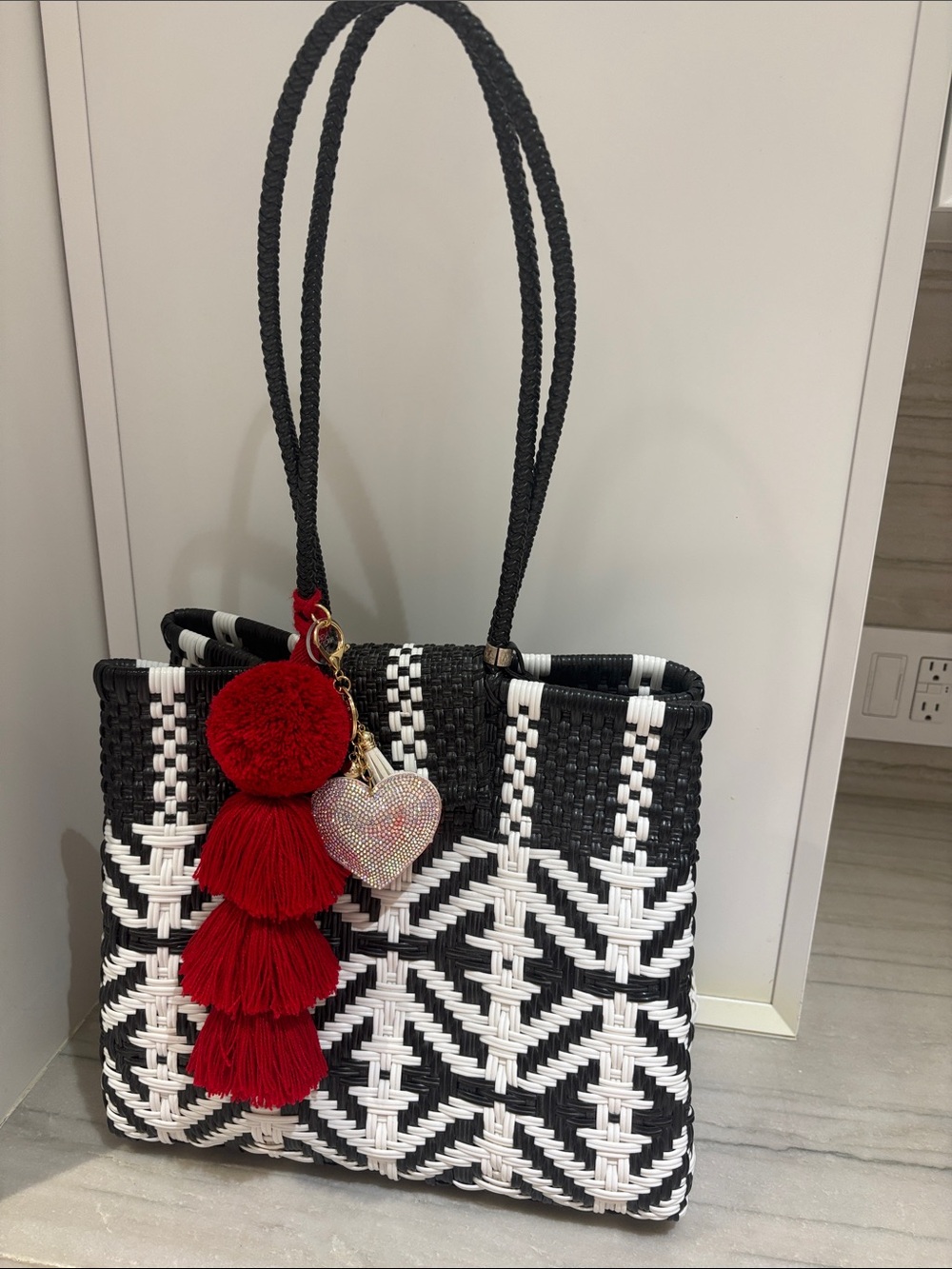 Woven Black & White Tote Bag with Red Tassel Charm
